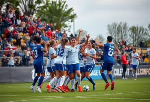 Bellarmine men's soccer team celebrating a goal during a match.