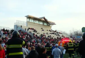 Emergency responders at the scene of a bleacher collapse during a high school football game.