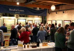 Guests enjoying the Kentucky Reverie event with art displays and live music.