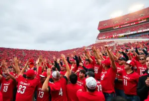 Fans cheering during Louisville Cardinals vs. Miami Hurricanes game