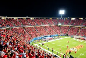 Fans cheering for the Louisville Cardinals football team at L&N Federal Credit Union Stadium
