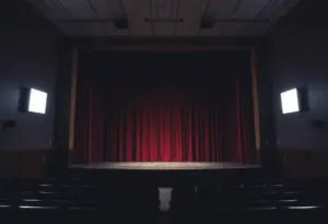 Empty theater stage representing educational safety concerns