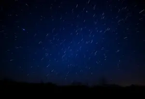 Night sky with meteors from the Orionid meteor shower.