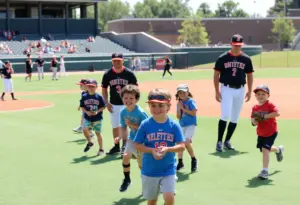 University of Louisville baseball players mentoring Miracle League children at Jim Patterson Stadium