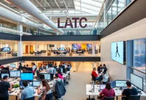 Interior view of the AMPED Tech and Learning Center, with people participating in technology training.