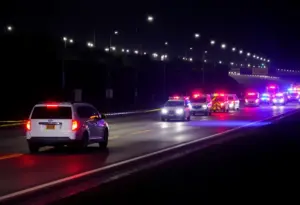 Emergency vehicles at the scene of a fatal crash on Preston Highway