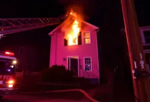 Firefighters battling a house fire in Louisville