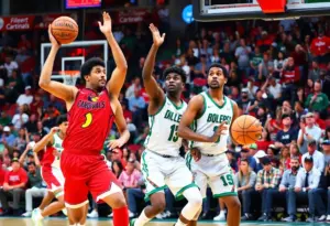 Louisville Cardinals players in action during the game against Ohio Bobcats