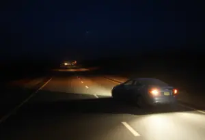 Scene of a street with emergency lights and a motor type bike