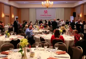 Participants at the Pack the Sack Fundraiser enjoying dinner and engaging in charity activities.