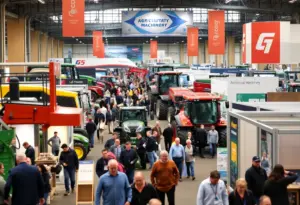 Attendees exploring agricultural machinery at a trade show