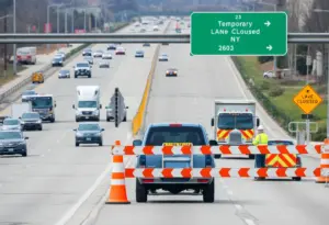 Construction workers directing traffic on I-71 in Louisville, KY.