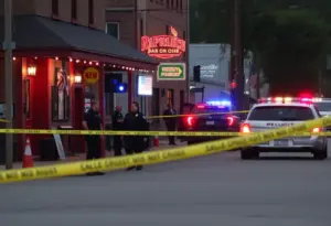 Police at the scene of a shooting in a neighborhood bar